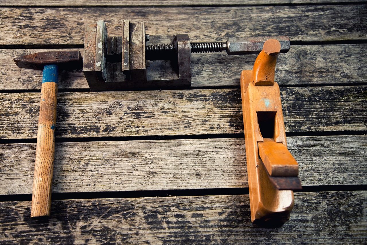Hand tools on a wooden workbench